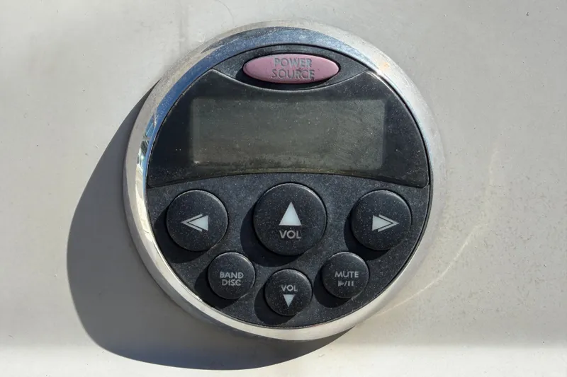 Slide: The Image of Close-up of a 2007 Sea Ray 240 Sundancer boat audio control panel. - 32