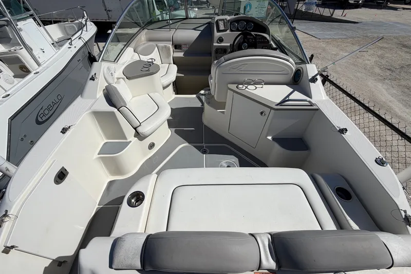 Slide: The Image of 2007 Sea Ray 240 Sundancer boat interior with seating and dashboard view. - 16