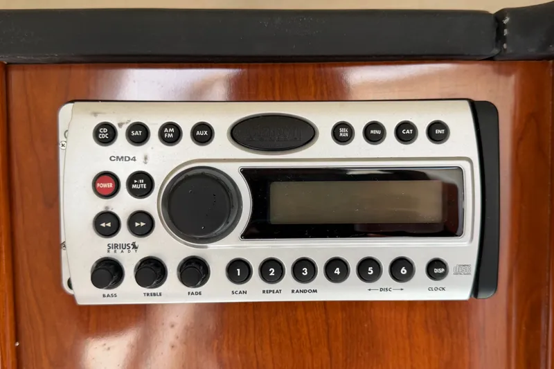 Slide: The Image of Clarion CMD4 stereo system on a 2007 Sea Ray 240 Sundancer boat dashboard. - 50