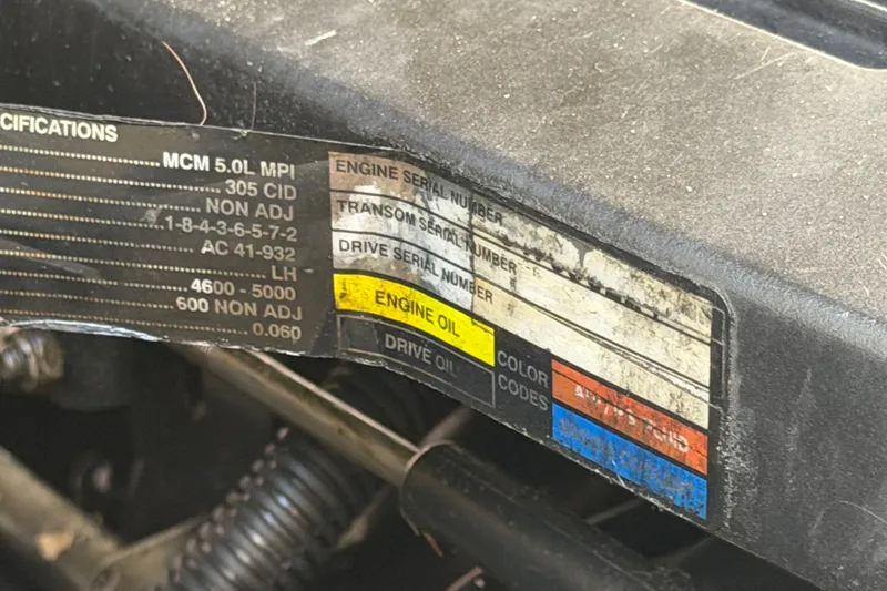 Slide: The Image of Label on a 2007 Sea Ray 240 Sundancer engine, showing specifications and serial numbers. - 90
