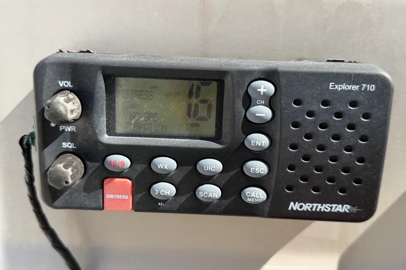 Slide: The Image of Northstar Explorer 710 marine radio on 2007 Sea Ray 240 Sundancer boat dashboard. - 31