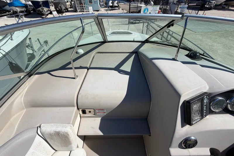 Slide: The Image of 2007 Sea Ray 240 Sundancer boat interior with dashboard and seating area. - 37
