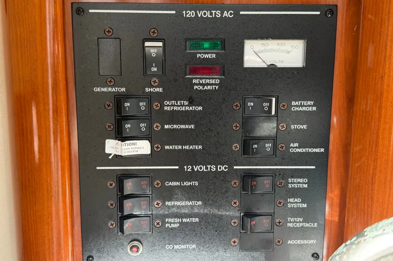 Slide: The Image of Electrical control panel on a 2007 Sea Ray 240 Sundancer boat. - 51