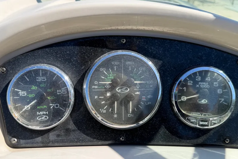 Slide: The Image of Dashboard gauges of a 2007 Sea Ray 240 Sundancer boat. - 30