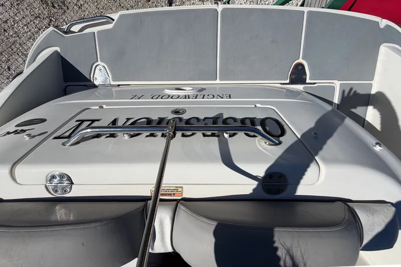 Slide: The Image of 2007 Sea Ray 240 Sundancer boat deck with seating and logo, docked in Englewood, FL. - 87