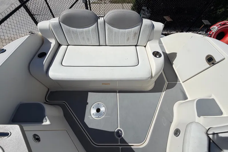 Slide: The Image of 2007 Sea Ray 240 Sundancer boat interior with seating and deck details. - 80