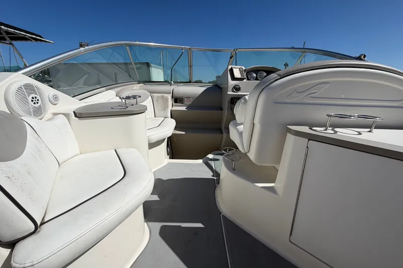 Slide: The Image of 2007 Sea Ray 240 Sundancer boat interior with seating and steering console. - 23