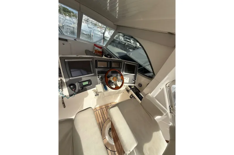 Slide: The Image of Interior cockpit of 2010 Maritimo 500 Offshore Convertible yacht with navigation equipment. - 16