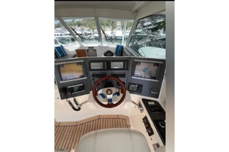 Slide: The Image of Helm of 2010 Maritimo 500 Offshore Convertible with advanced navigation systems. - 13