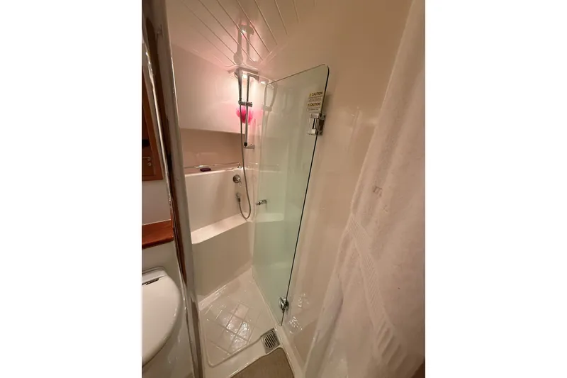 Slide: The Image of Bathroom shower area in 2010 Maritimo 500 Offshore Convertible yacht. - 33