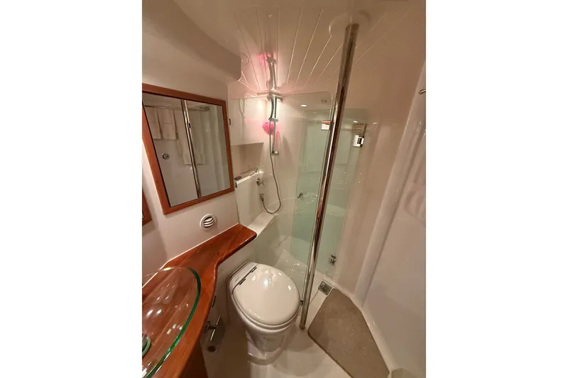 Slide: The Image of Luxurious bathroom in 2010 Maritimo 500 Offshore Convertible yacht, featuring modern fixtures and elegant design. - 30