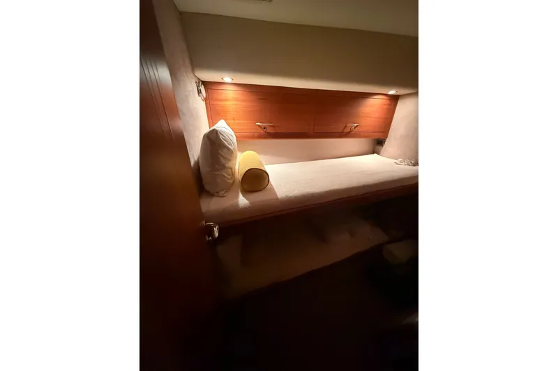 Slide: The Image of 2010 Maritimo 500 Offshore Convertible cabin with cozy bed and ambient lighting. - 32