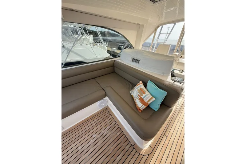 Slide: The Image of Luxurious seating area on 2010 Maritimo 500 Offshore Convertible yacht with colorful cushions. - 14