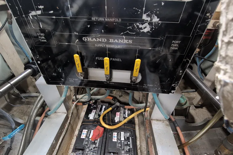 Slide: The Image of Engine room of 1990 Grand Banks 36 Classic with fuel panel and batteries. - 59