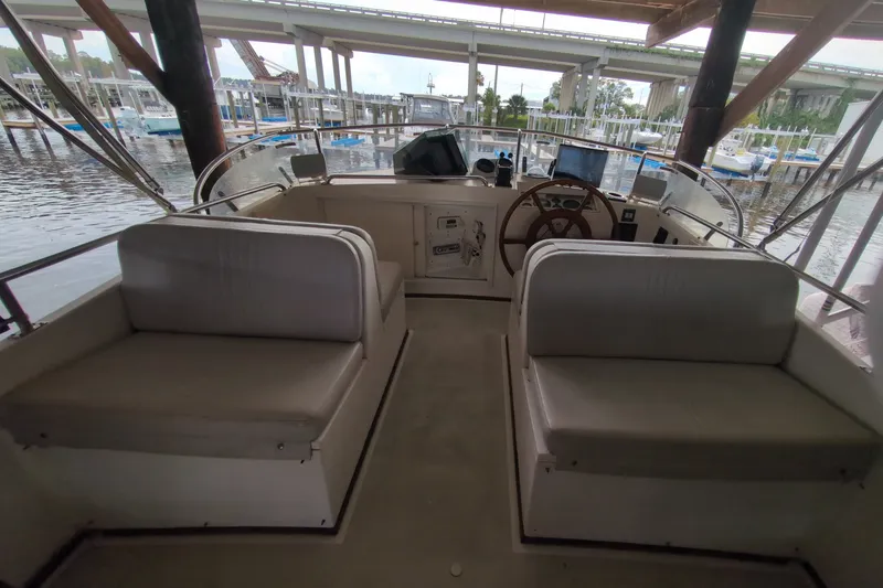 Slide: The Image of Interior view of 1990 Grand Banks 36 Classic yacht helm with seating and steering wheel. - 27