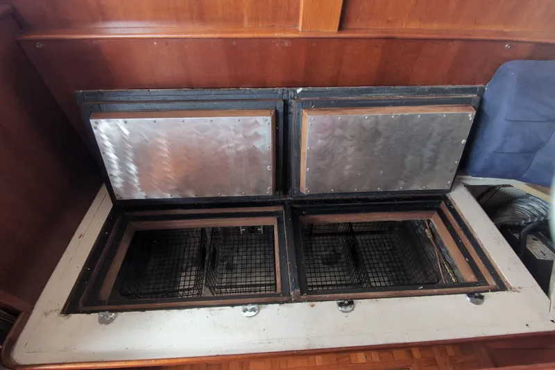 Slide: The Image of Interior view of a 1990 Grand Banks 36 Classic boat's storage compartment. - 32