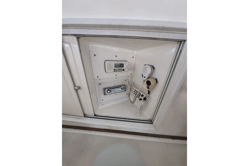 Slide: The Image of Control panel with communication devices on a 1990 Grand Banks 36 Classic boat. - 29