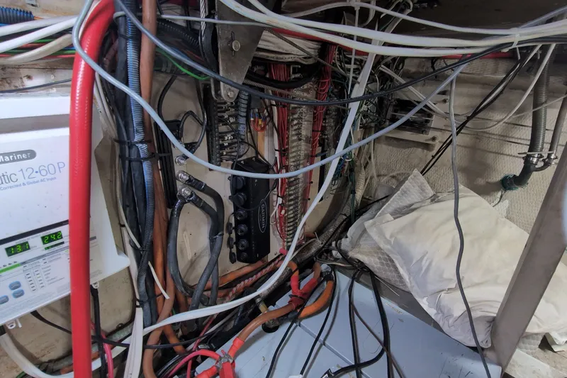 Slide: The Image of Electrical wiring and equipment inside a 1990 Grand Banks 36 Classic boat. - 66
