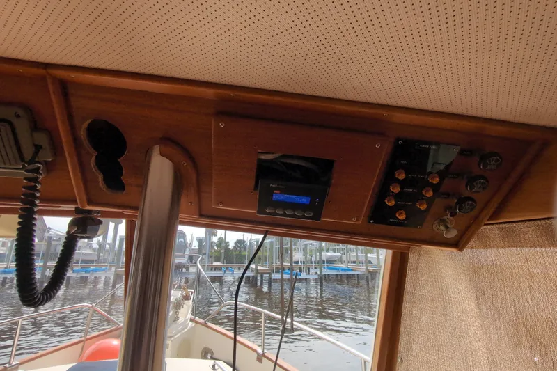 Slide: The Image of Interior view of 1990 Grand Banks 36 Classic boat dashboard with control panel. - 39