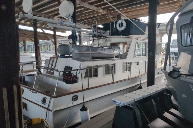 Slide: The Image of Grand Banks 36 Classic 1990 yacht docked in a covered marina. - 7