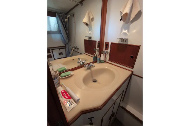 Slide: The Image of Bathroom sink area in a 1990 Grand Banks 36 Classic yacht. - 53