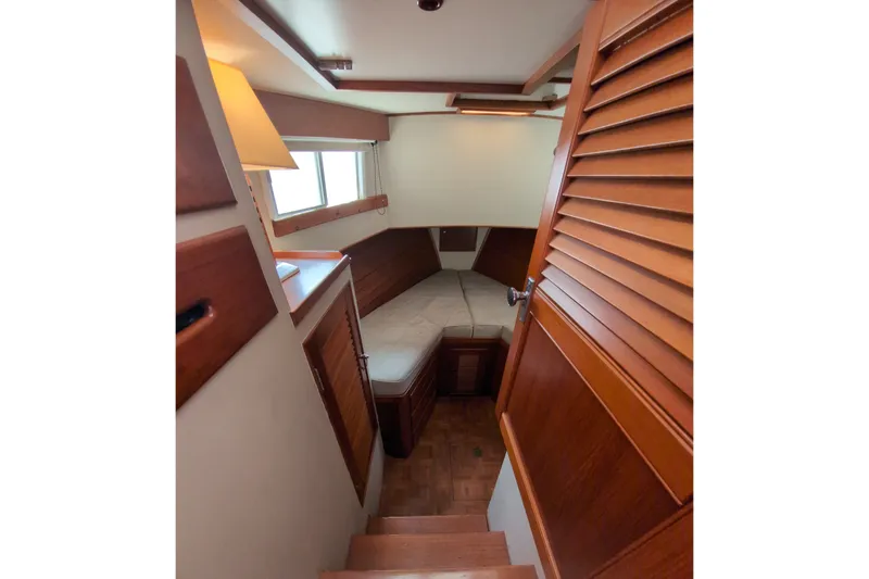 Slide: The Image of Cozy cabin interior of 1990 Grand Banks 36 Classic yacht with wooden finishes. - 41