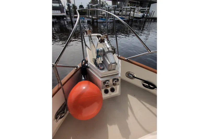 Slide: The Image of 1990 Grand Banks 36 Classic boat deck with equipment and orange buoy. - 13