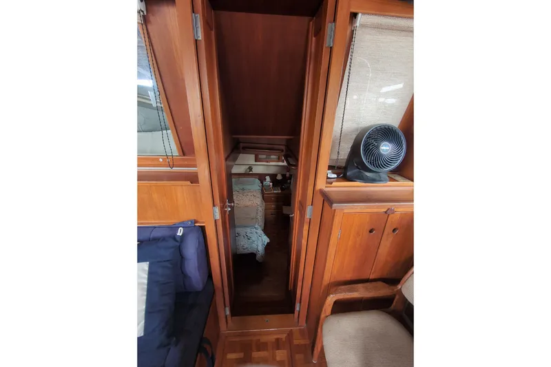 Slide: The Image of Interior view of 1990 Grand Banks 36 Classic yacht with wooden cabinetry and seating. - 45