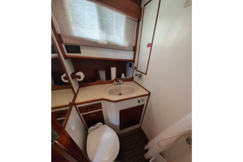 Slide: The Image of Bathroom interior of 1990 Grand Banks 36 Classic yacht, featuring sink and toilet. - 44