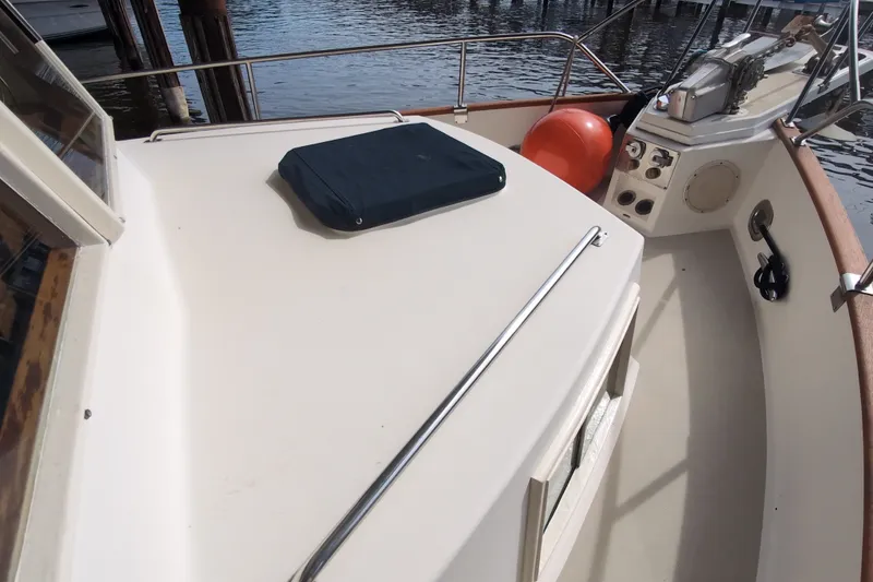 Slide: The Image of 1990 Grand Banks 36 Classic boat deck with railing and equipment. - 15