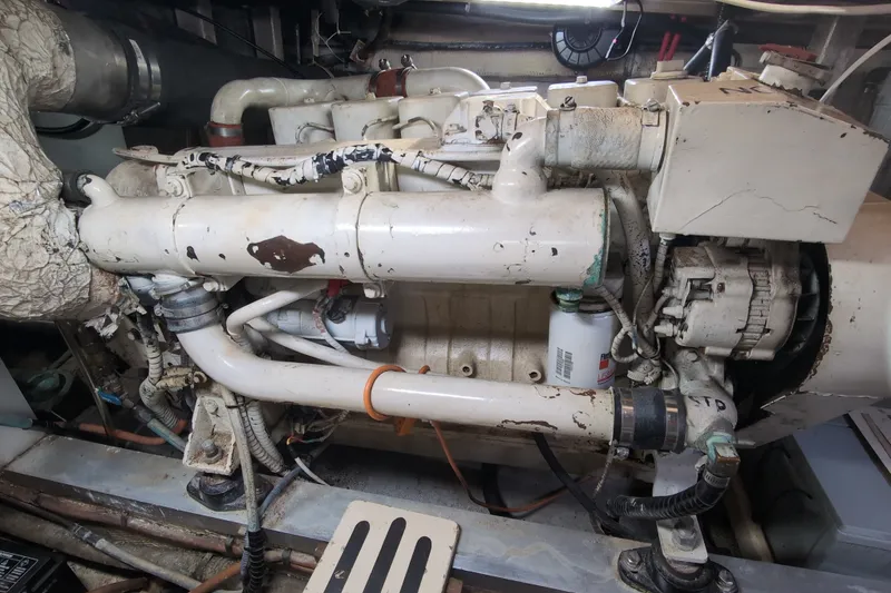 Slide: The Image of Engine room of a 1990 Grand Banks 36 Classic boat, showing detailed machinery components. - 57