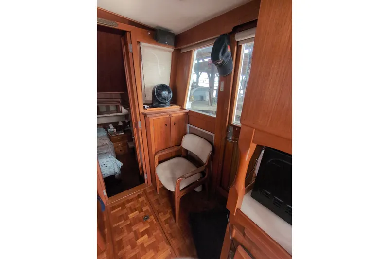 Slide: The Image of Interior of 1990 Grand Banks 36 Classic yacht with wooden furnishings and cozy seating. - 36