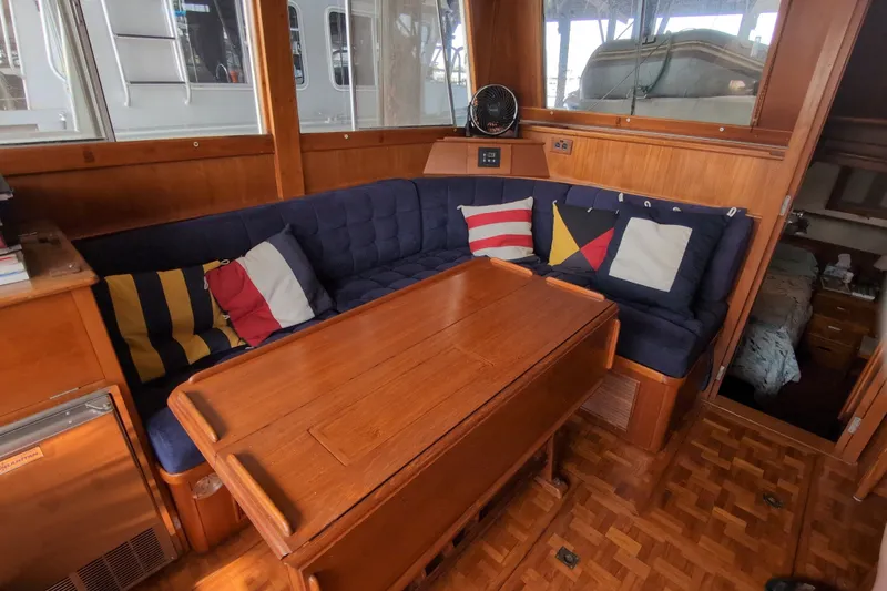 Slide: The Image of Cozy interior of 1990 Grand Banks 36 Classic yacht with nautical-themed cushions. - 31