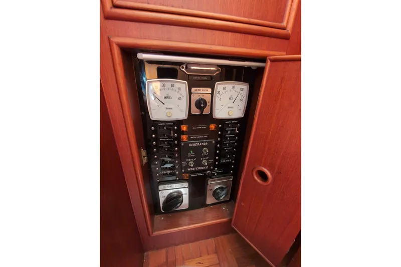 Slide: The Image of Electrical control panel on a 1990 Grand Banks 36 Classic boat. - 38