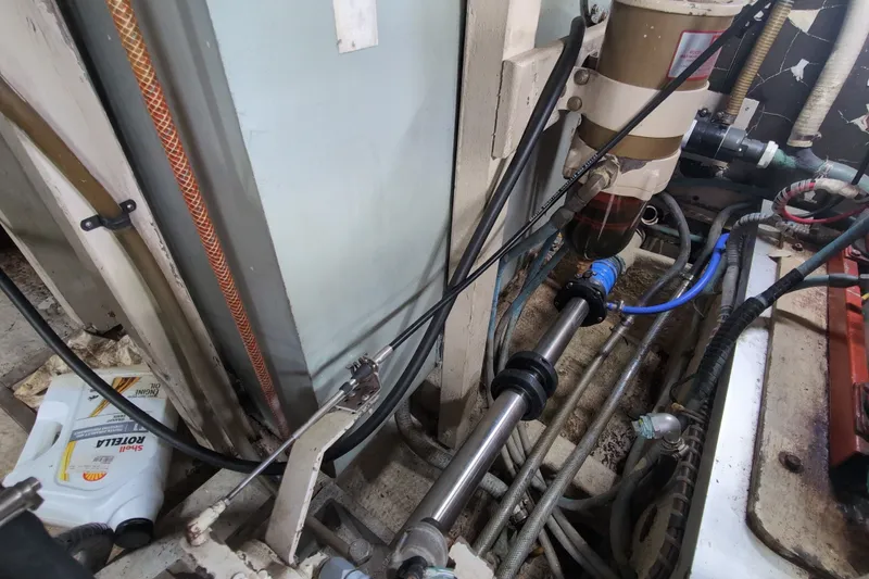Slide: The Image of Engine room of 1990 Grand Banks 36 Classic with visible mechanical components and wiring. - 62