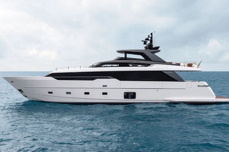 The Image of Luxurious 2026 Sanlorenzo SL96A yacht cruising on open sea under cloudy sky. - 1