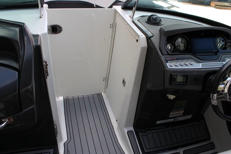 Slide: The Image of Interior view of 2021 Monterey 255SS Super Sport boat cockpit with steering wheel and controls. - 30
