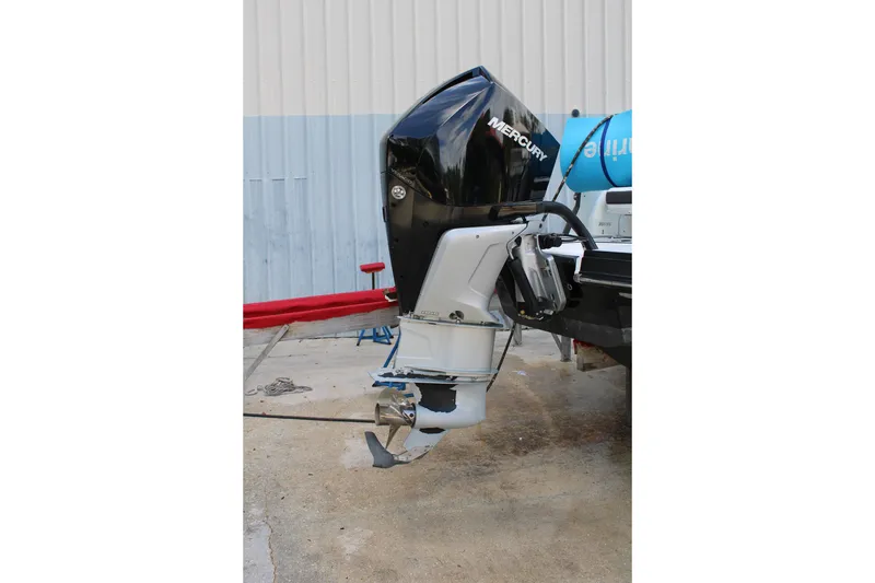 Slide: The Image of Outboard motor of a 2021 Monterey 255SS Super Sport boat, parked on concrete. - 10