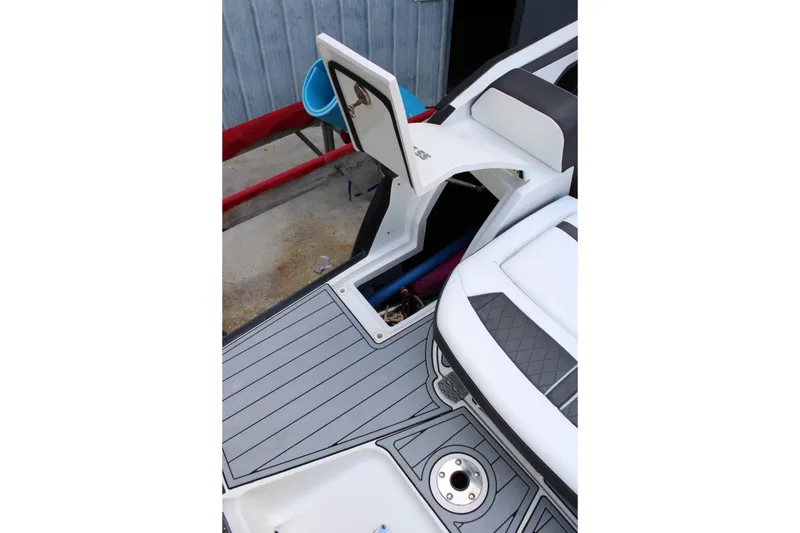 Slide: The Image of 2021 Monterey 255SS Super Sport boat interior with open storage compartment. - 40