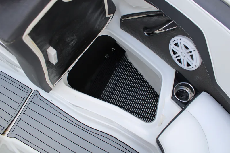 Slide: The Image of Interior view of 2021 Monterey 255SS Super Sport boat, featuring storage compartment and speaker. - 19