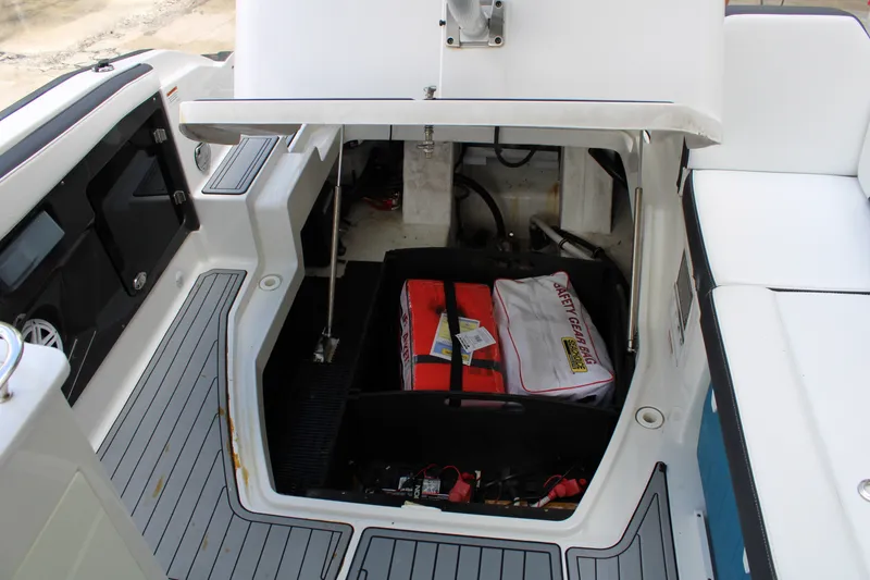 Slide: The Image of 2021 Monterey 255SS Super Sport boat storage area with safety gear and equipment. - 46