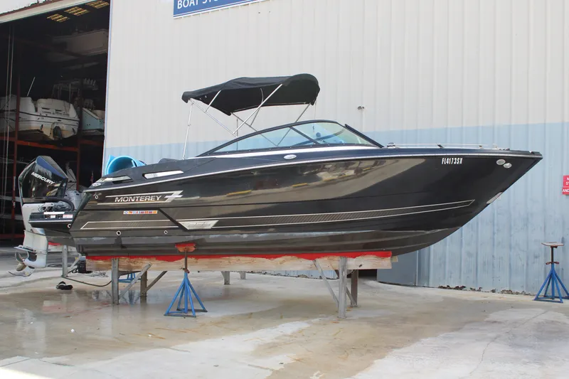 Slide: The Image of 2021 Monterey 255SS Super Sport boat on stands outside storage facility. - 4