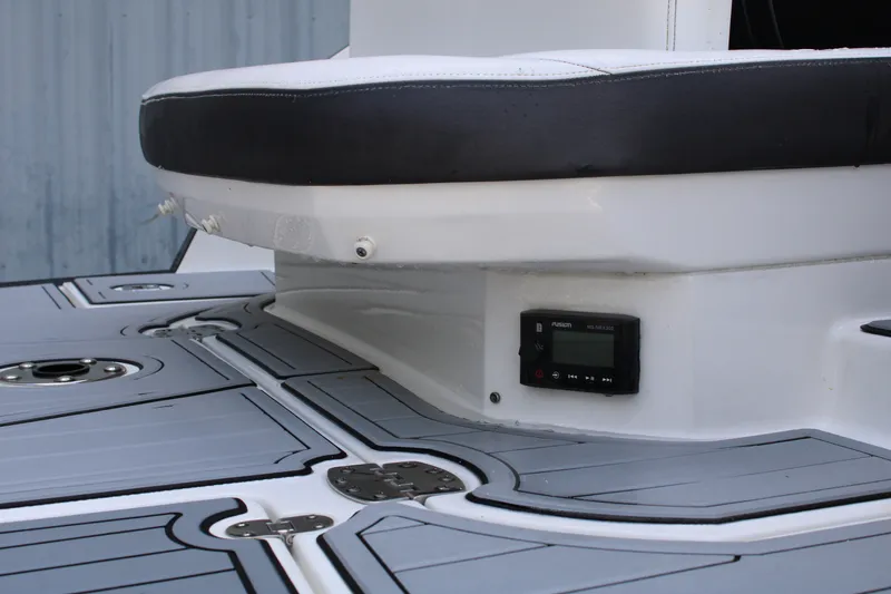 Slide: The Image of 2021 Monterey 255SS Super Sport boat interior with sleek seating and integrated audio system. - 13