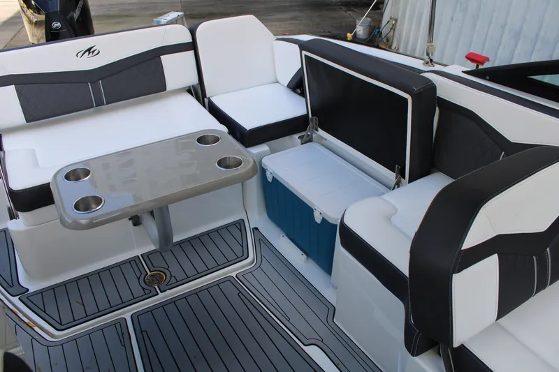 Slide: The Image of 2021 Monterey 255SS Super Sport boat interior with seating and table setup. - 37