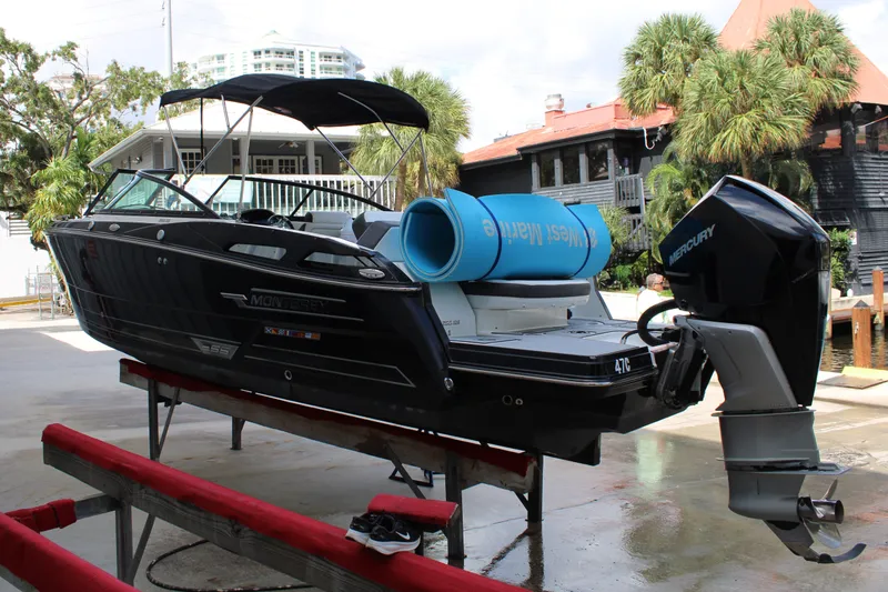 Slide: The Image of 2021 Monterey 255SS Super Sport boat on display with Mercury outboard engine. - 8