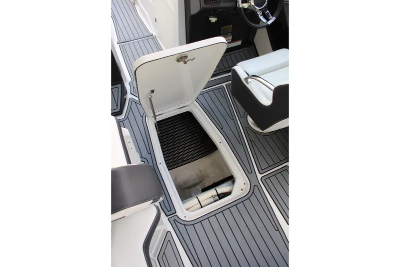 Slide: The Image of 2021 Monterey 255SS Super Sport boat interior with open storage compartment. - 32