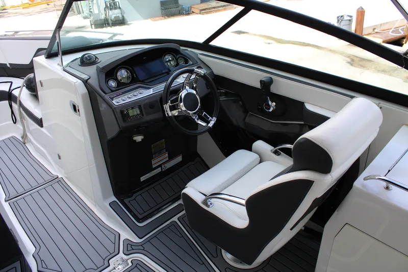 Slide: The Image of 2021 Monterey 255SS Super Sport boat interior with sleek dashboard and comfortable seating. - 26