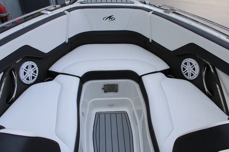 Slide: The Image of Interior of 2021 Monterey 255SS Super Sport boat with white seating and speakers. - 18