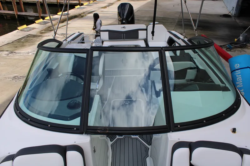 Slide: The Image of 2021 Monterey 255SS Super Sport boat docked, showcasing sleek design and spacious interior. - 21
