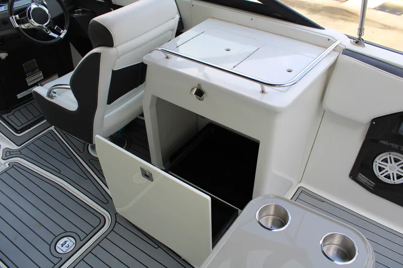 Slide: The Image of Interior of 2021 Monterey 255SS Super Sport boat with seating and storage compartments. - 33